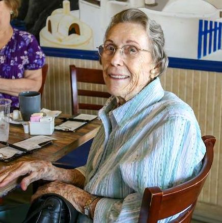 An older woman smiling at the camera