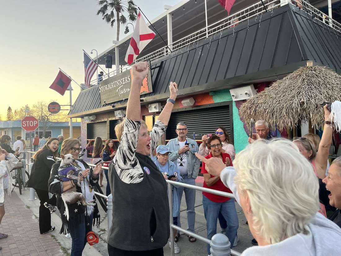 a woman with her arms up cheering. this is karen love. (2025 Gulfport Mayoral Election Results)