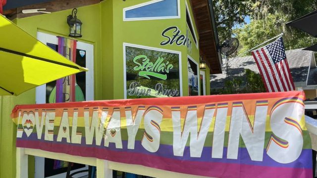 a rainbow sign that reads 