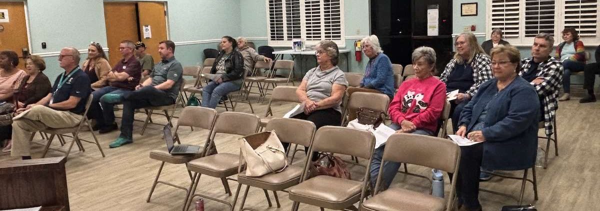 People sitting in city hall.