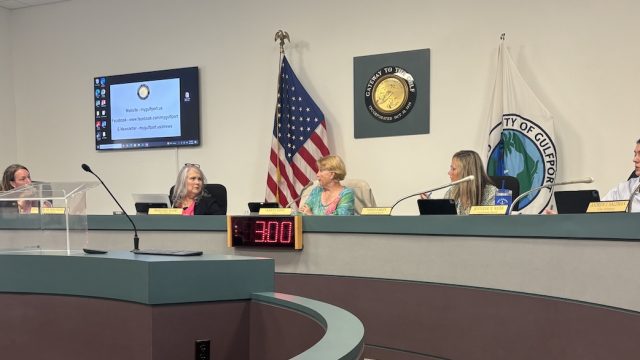 5 women sitting on the Gulfport city council dais.