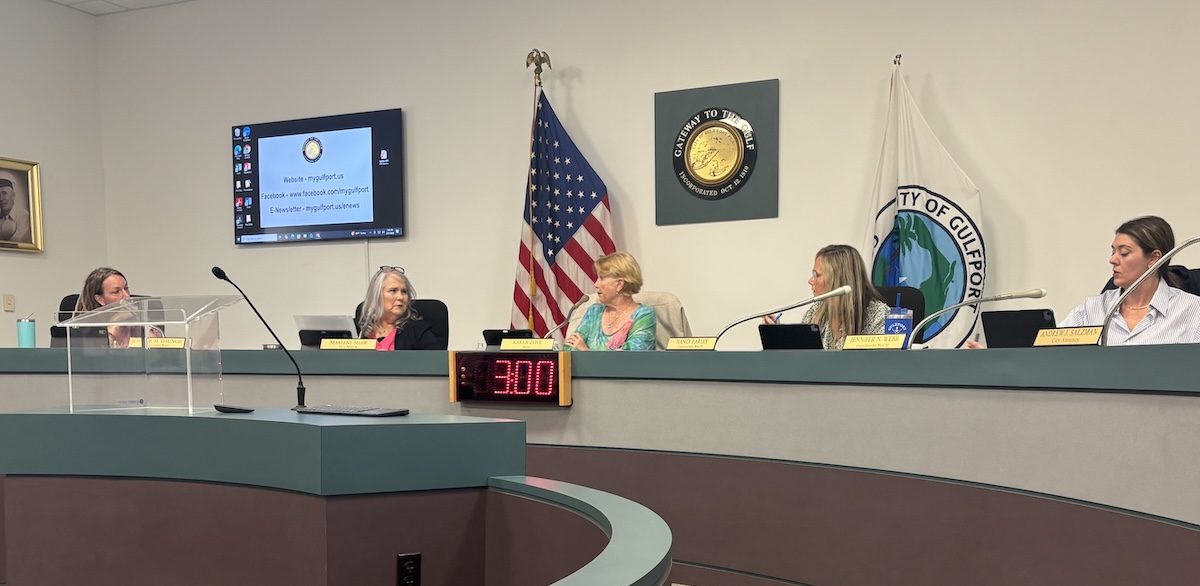 5 women sitting on the Gulfport city council dais.
