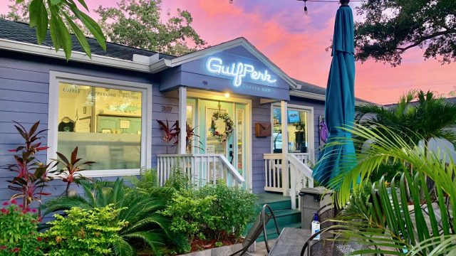 A little blue coffee shop that says Gulfperk Coffee Shop